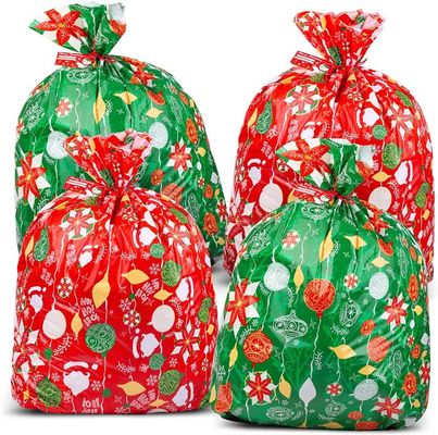 Fertigen Sie bunte Plastikgeschenk-Verpackungs-Taschen für enorme Weihnachtsgeschenk-Verpackung kundenspezifisch an